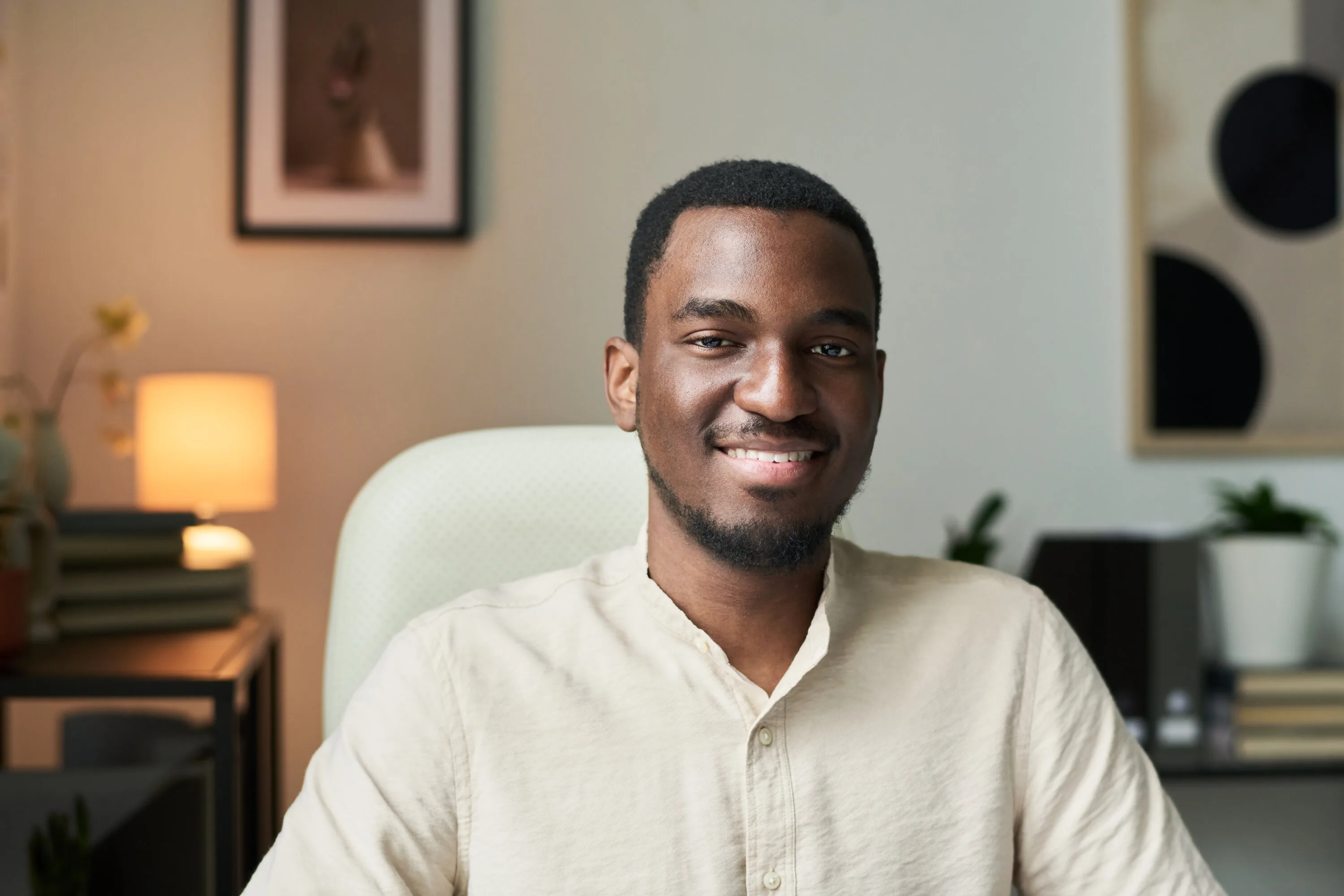 Portrait of African American Man Smiling in Modern Office Setting